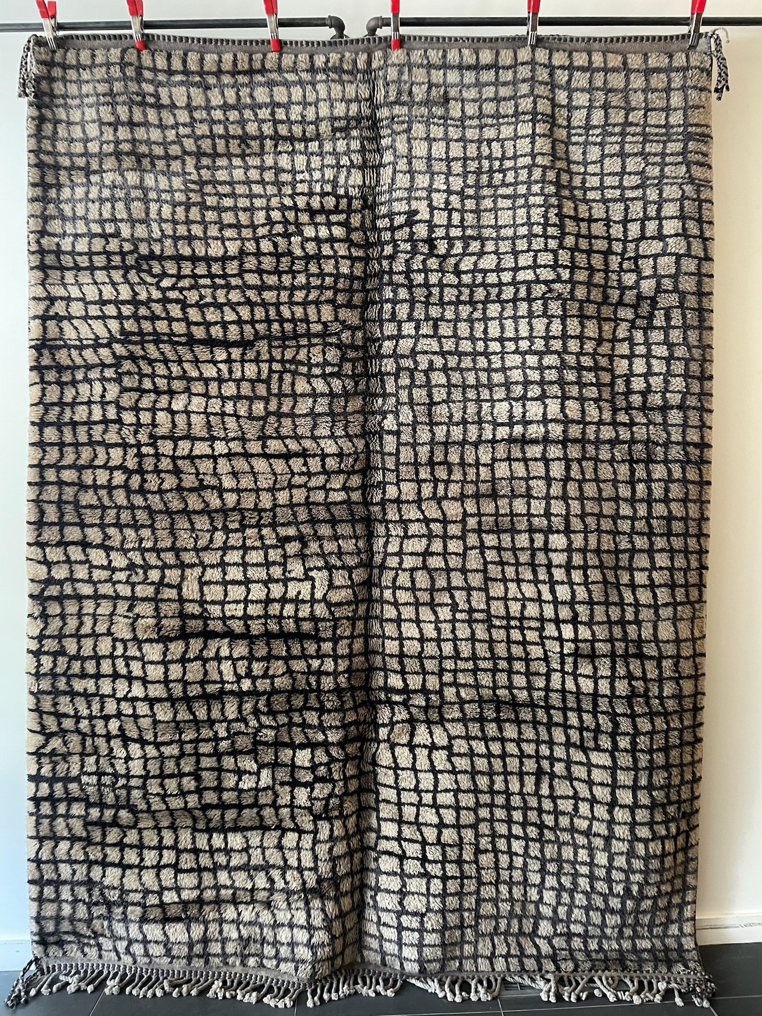 soft brown hand-knotted Moroccan wool rug with black grid