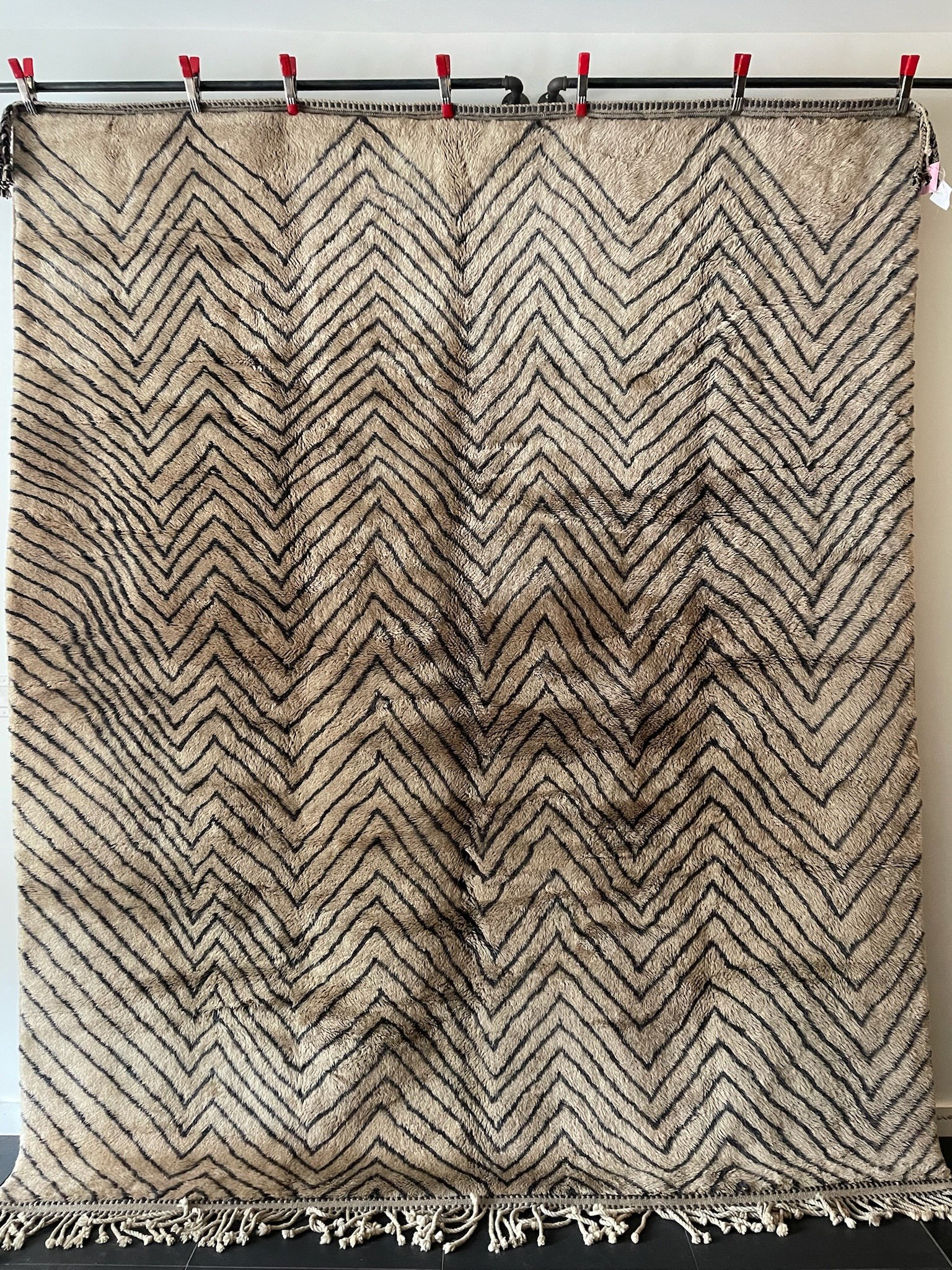 large gold hand-knotted Moroccan wool rug with black zig-zag design