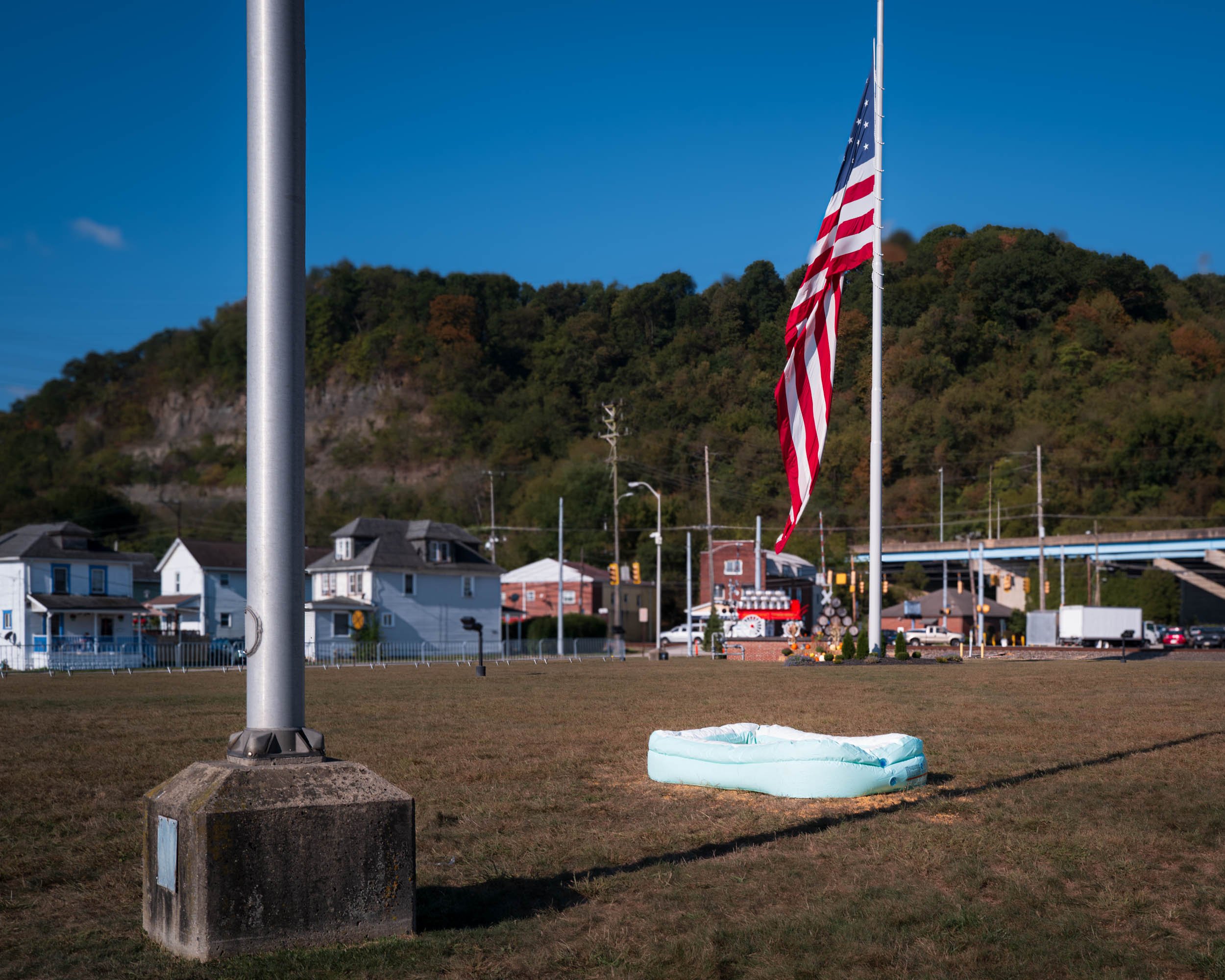 Iron City brewery half mast flag in honor of Charlie Kirk