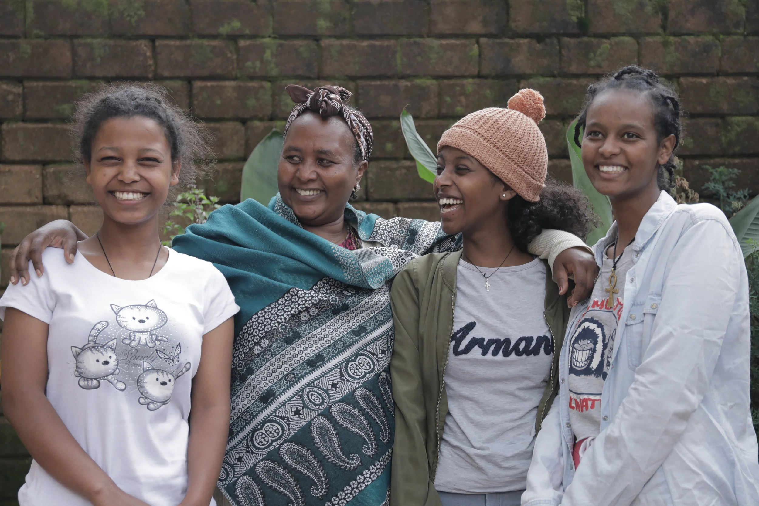 Gondar House Mom, Wossenie, with three of our girls.