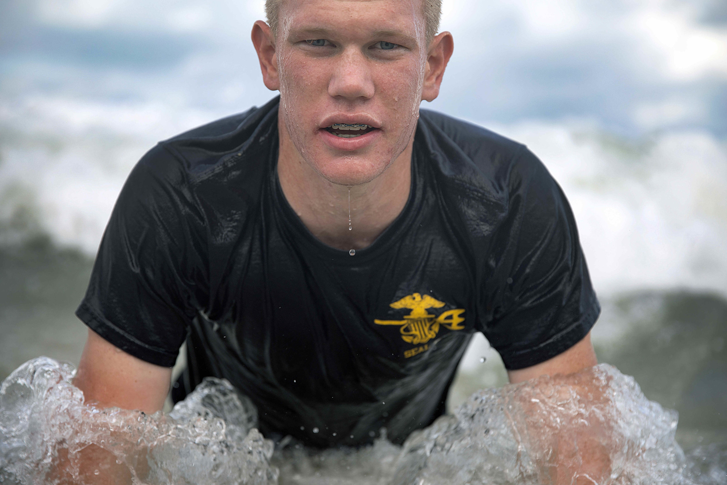  U.S. Naval Sea Cadet Corps Petty Officer 1st Class Overfield, Centurion Battalion, does push-ups during beach physical training. After successful completion of recruit training, Sea Cadets may choose from a wide variety of advanced training opportun