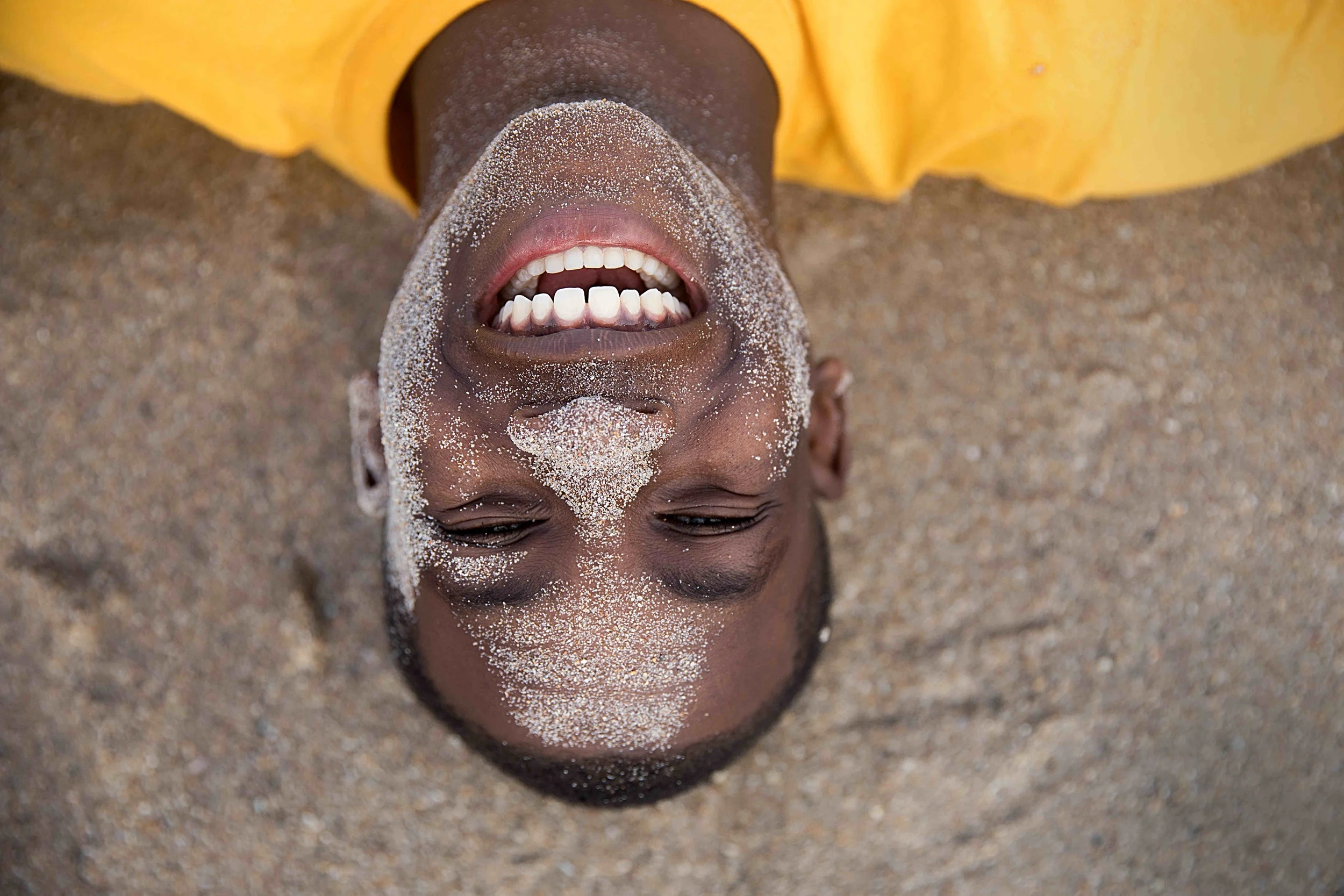  U.S. Naval Sea Cadet Corps Seaman Apprentice Wilson, Palm Beach Division, braces himself against the surf of the Atlantic Ocean that is about to wash over him during beach physical training. Recruit training is designed to familiarize cadets with Na