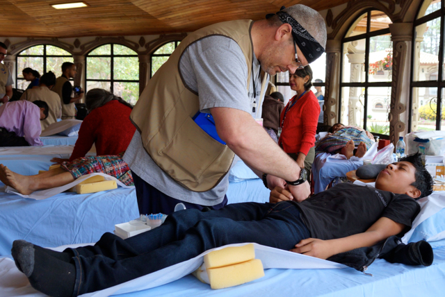 Veteran Volunteer Chris O’Connor Builds Morale and Keeps Patients and Practitioners Smiling