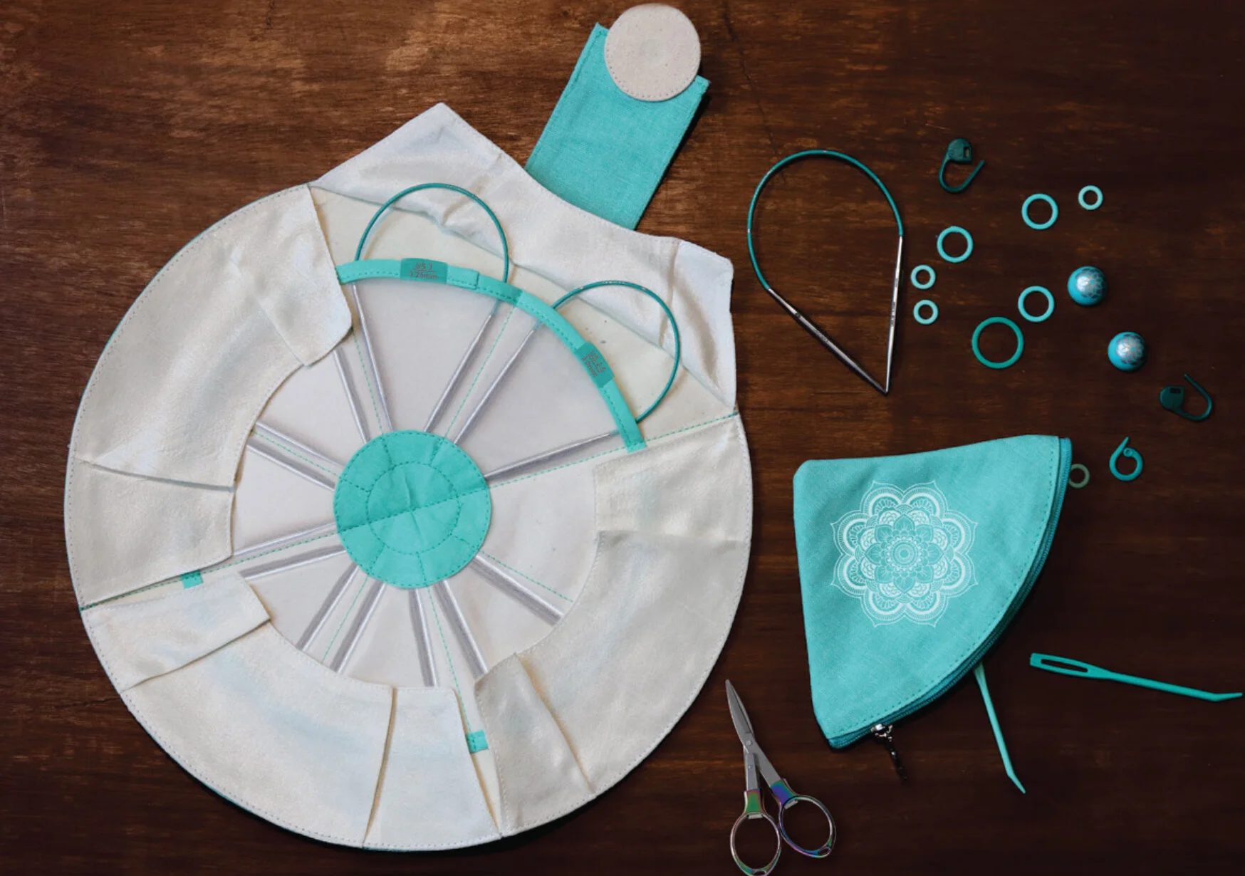 Set of 8 metal 9" circular knitting needles in canvas pouch with contents on display