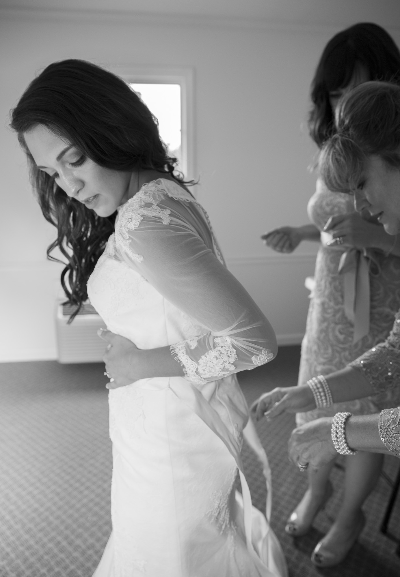 The woman in white finishing the final touches before the walk down the aisle. Pretty moving moment; both Alanna's adoptive mother + birth mother were there by her side the entire time.