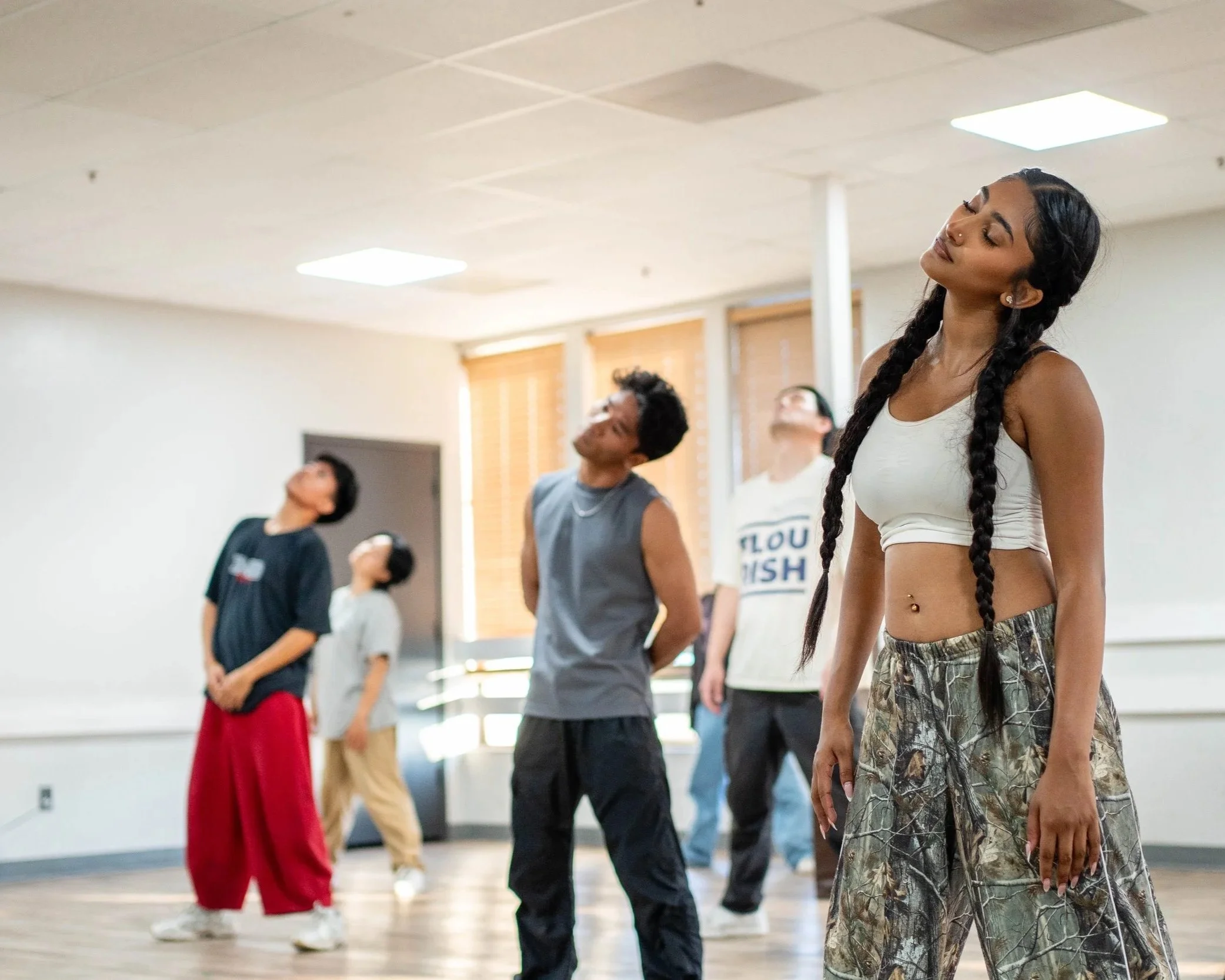 Students warming up before a weekly hip hop dance class at re.DEFINE Dance Studio in Hayward, California.