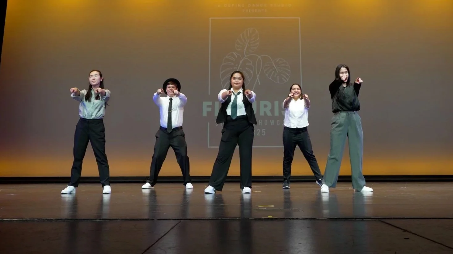 Beginner Adult Hip Hop students performing on stage at a re.DEFINE Dance Studio showcase.