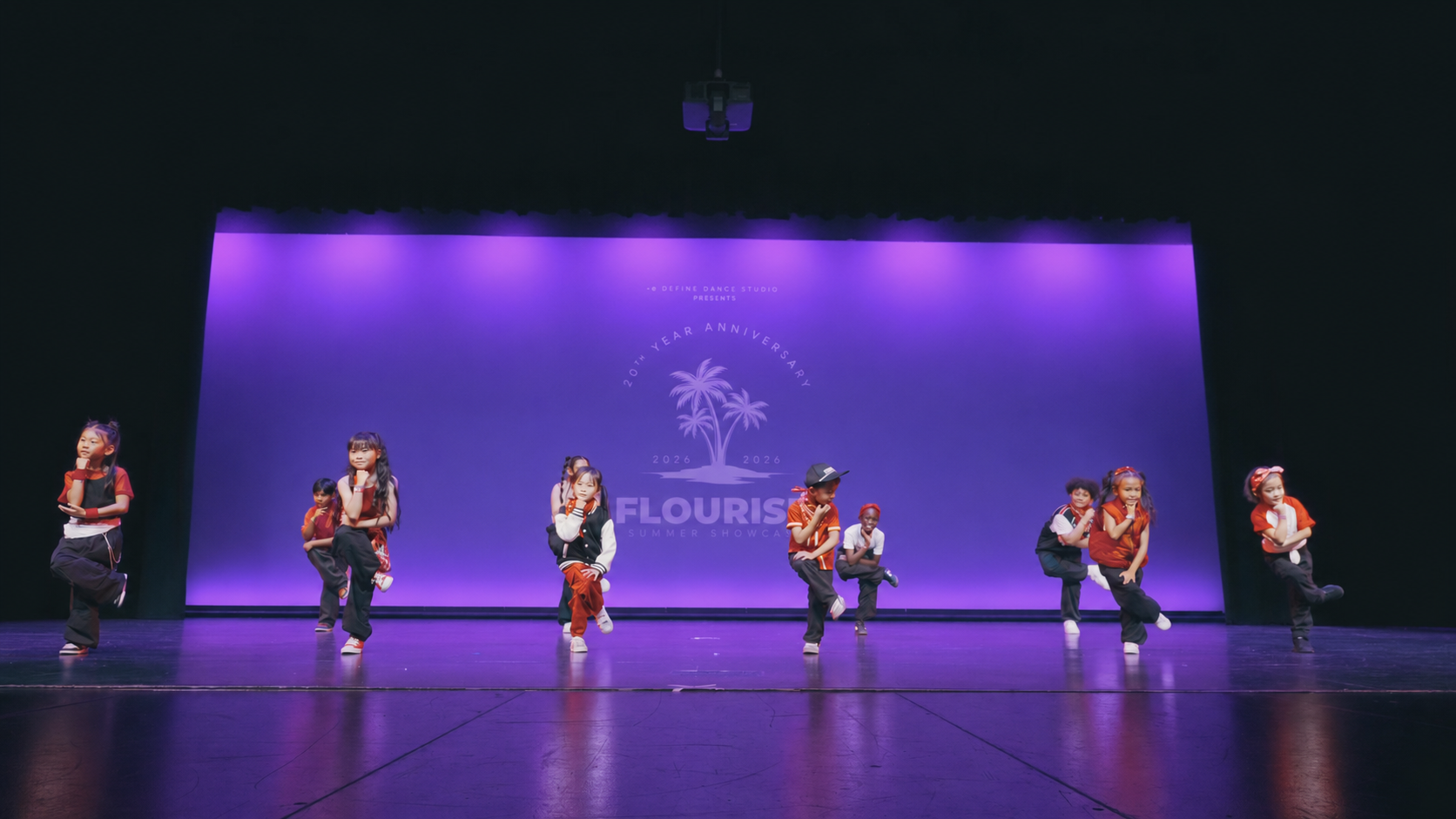 Mini Hip Hop students performing on stage during a re.DEFINE Dance Studio showcase in Hayward, California.
