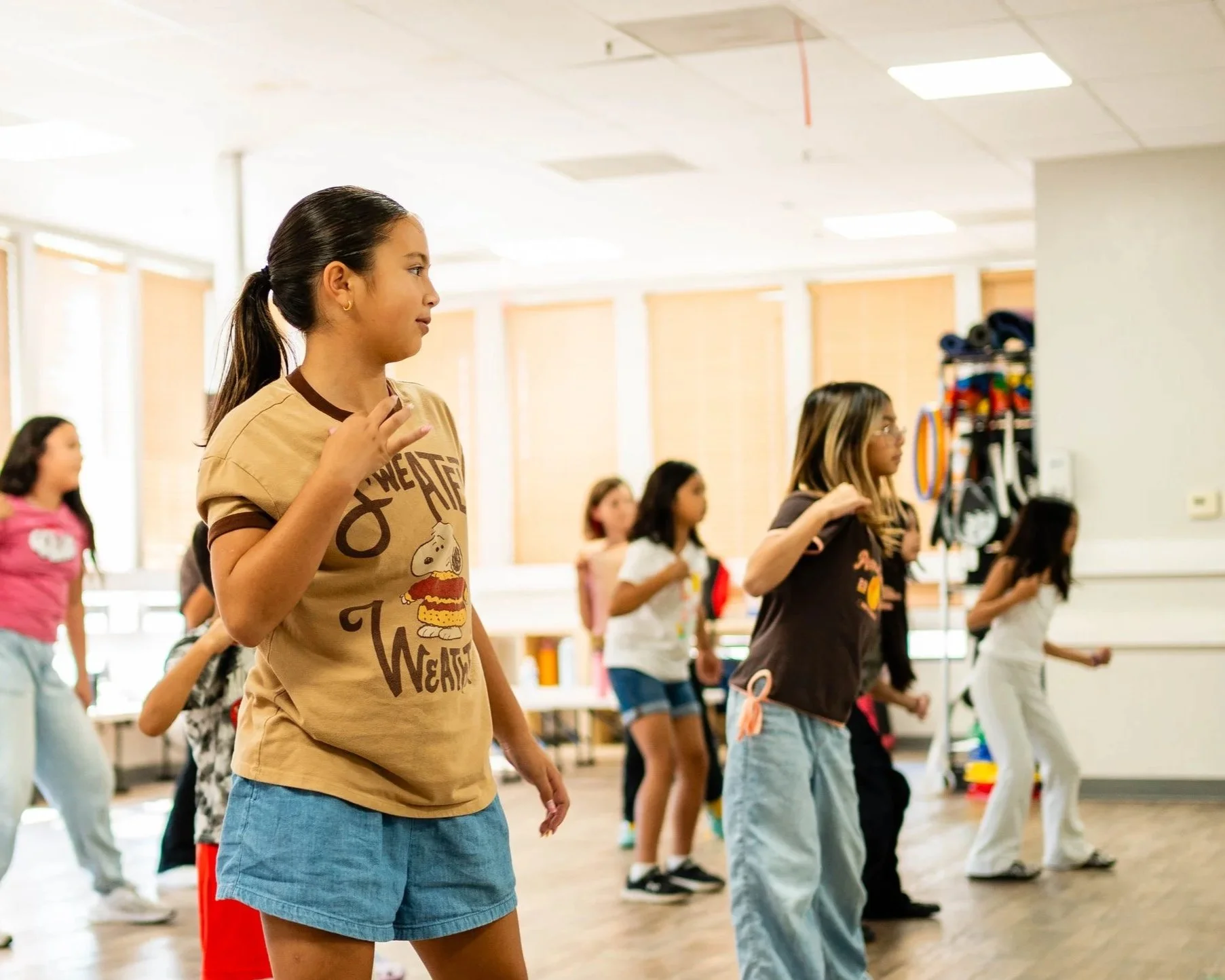 Students learning hip hop choreography during a weekly dance class at re.DEFINE Dance Studio.