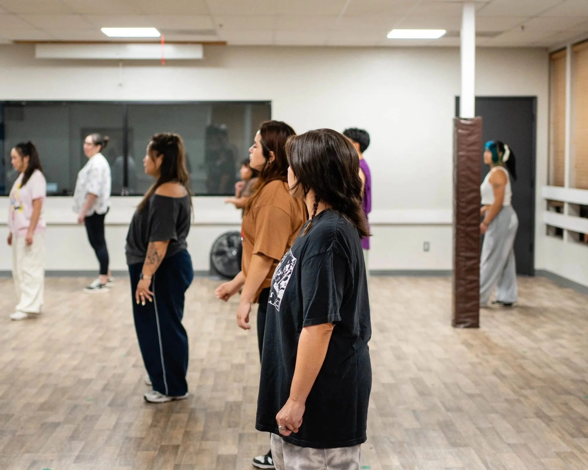 Adult dancers rehearsing together during a re.DEFINE Dance Team practice in Hayward, California.