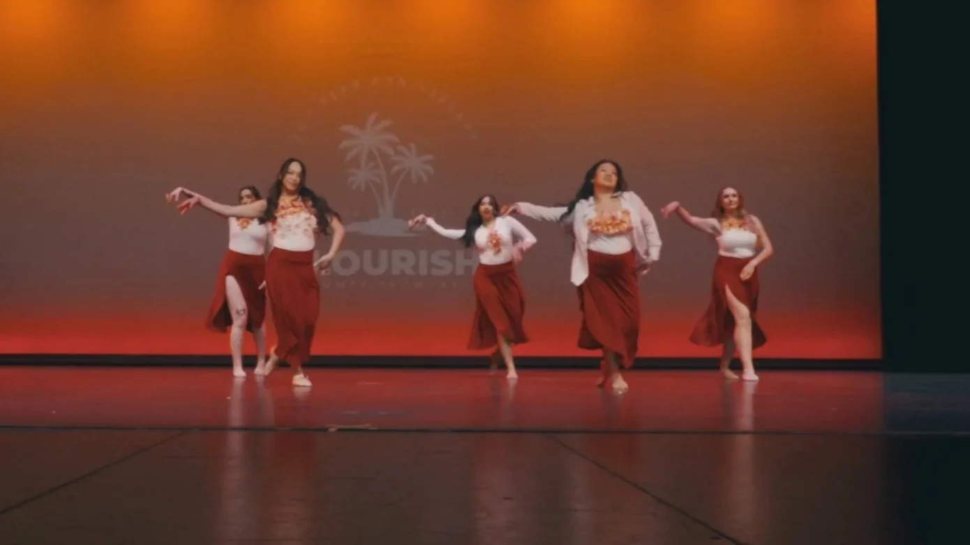 Jazz Flow dancers performing expressive choreography at a re.DEFINE Dance Studio showcase.