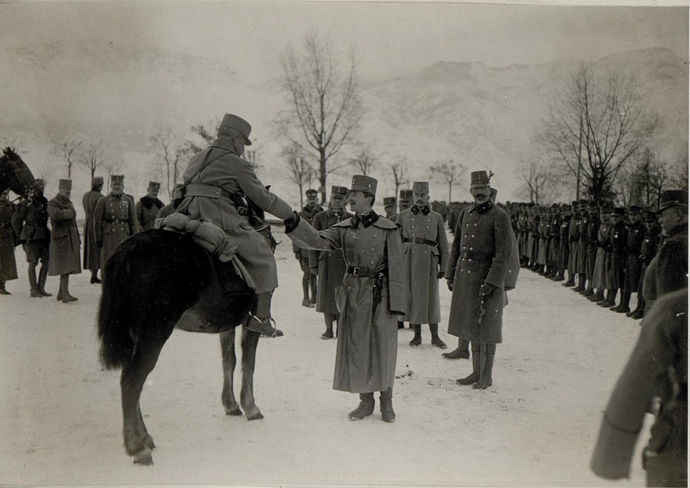 Karl warmly shakes hands with a soldier during a visit to front lines in Levico, Italy in 1917. 