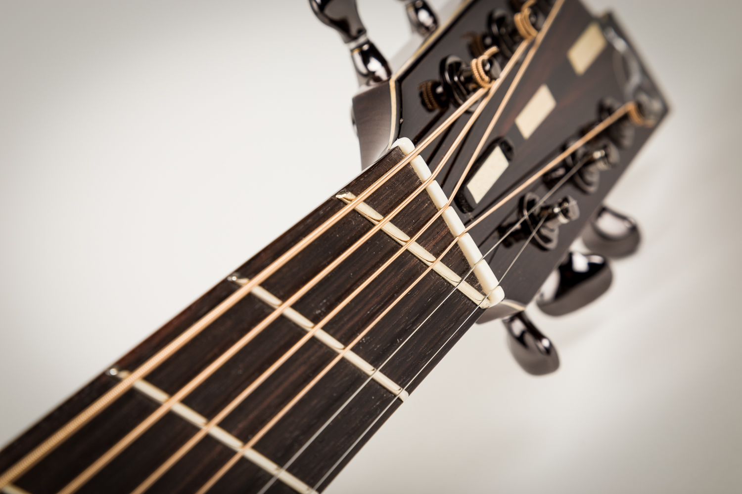 Slant-fret zero-fret and nut spacer