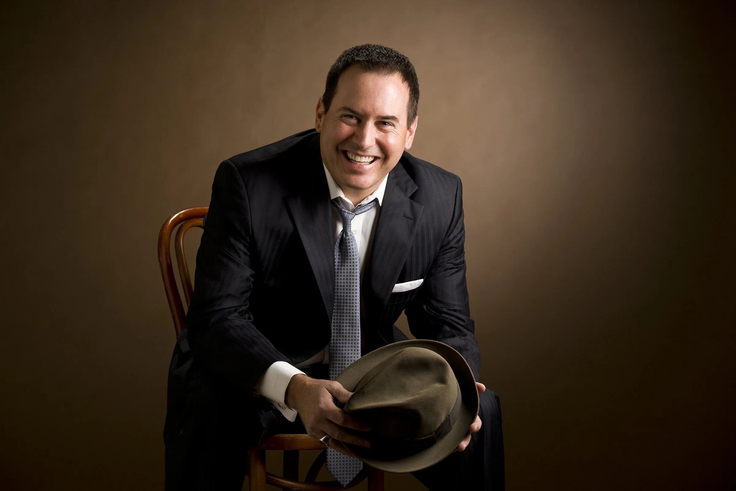 Wade Tower seated with hat.jpg