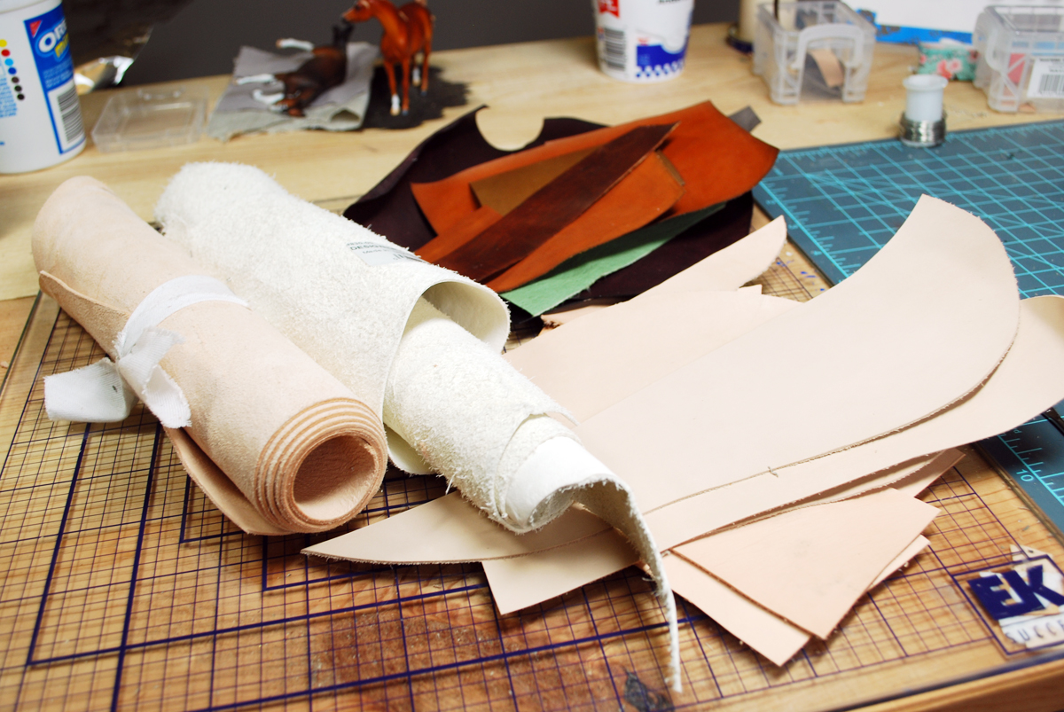 Some of my stash - tooling lamb, part of a white garment hide, turkish & tooling calf scraps, and pieces I've dyed for other projects.