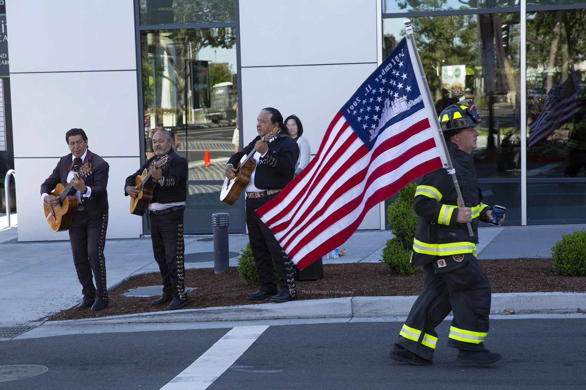  A runner passes mariachis during the San Jose Half Marathon 