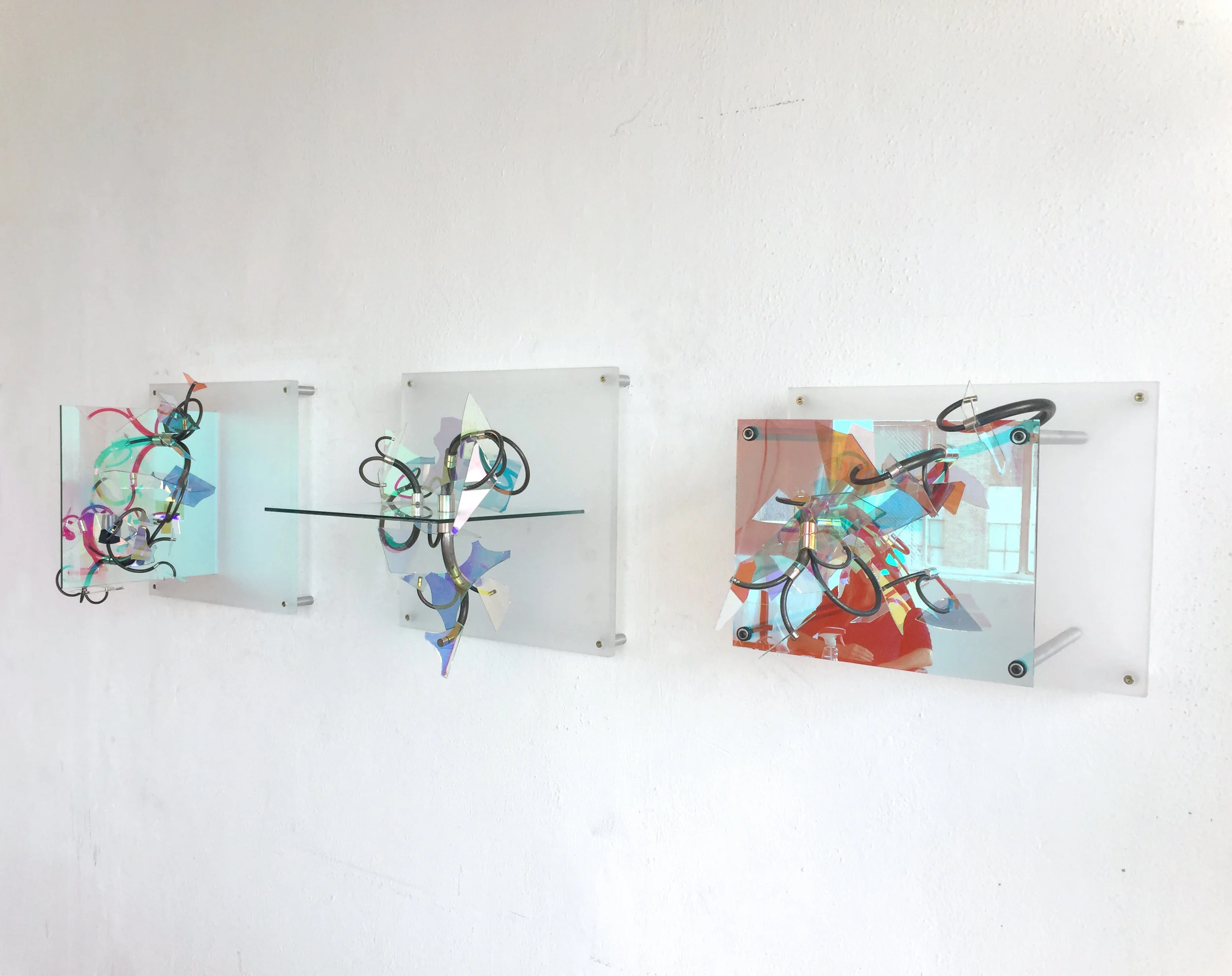 Dipole A,B,& C, 2017-2018, steel, acrylic, dichroic glass, neodymium, aluminum, triptych, 18"h x 18'w x 16"d