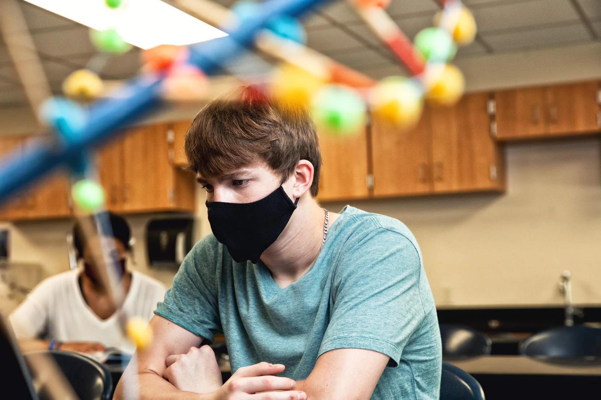 High School student and football player in Council Bluffs, poses for a photograph with a masks on for the Together We Can Campaign.