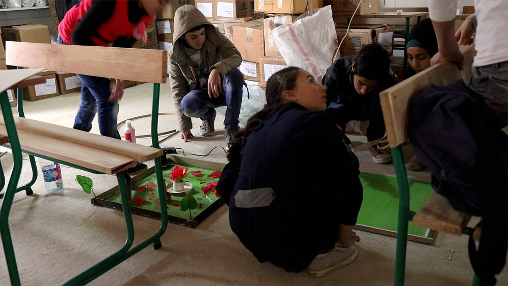 Many of the groups started by building settings with green and even flowers (like in the hospital grounds, left). 