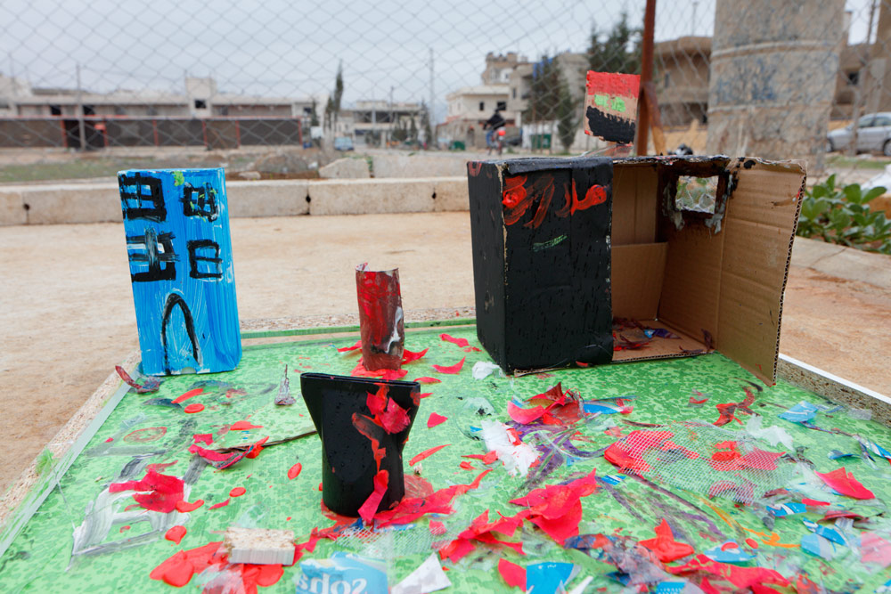 A destroyed school, "empty except for ghosts." 