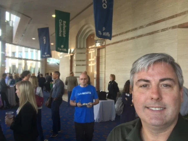 Rev1 Ventures DemoDay 2016. I'm expanding, exploring and enjoying. Great afternoon hearing startup stories and their inspirational tales of success. Photo taken in the lobby of the Riffe Center. This gentleman in the blue is unwittingly photobombing without a bit of effort - he just is. You'll be able to read more about this new business phenomena in Columbus Business First this Friday. Missed Demo Day? See the replay here: bit.ly/R1DDLivestream