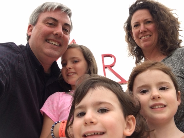 My family and I in front of the (partially seen) 100 ft. tall ART sign on the campus of CCAD.