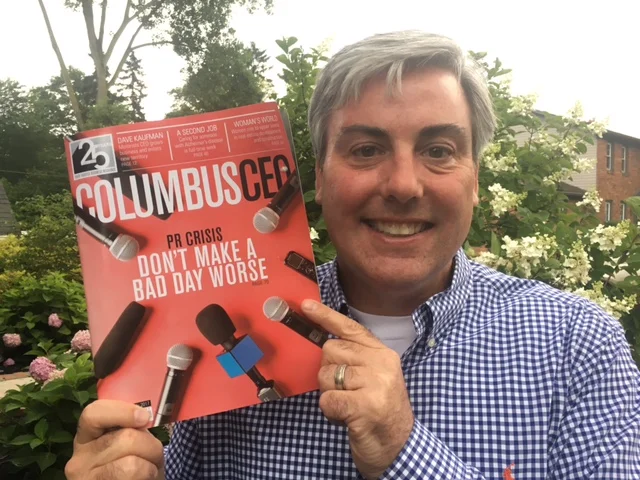 Holding a copy of this month's Columbus CEO magazine.