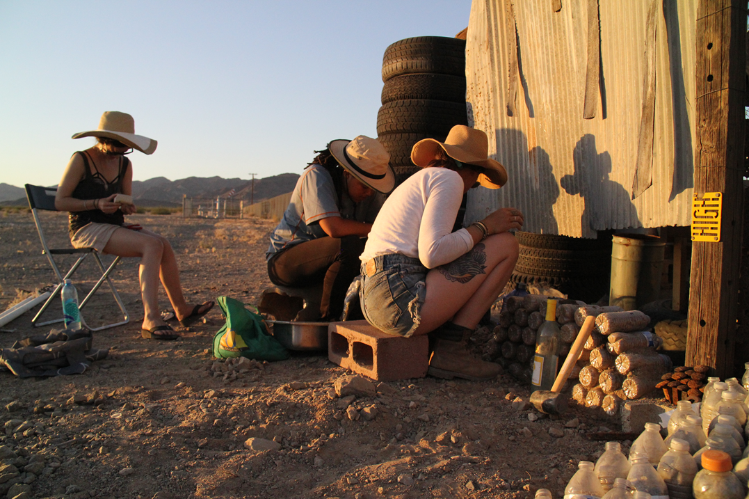 Participants work together to build an outdoor dry toilet