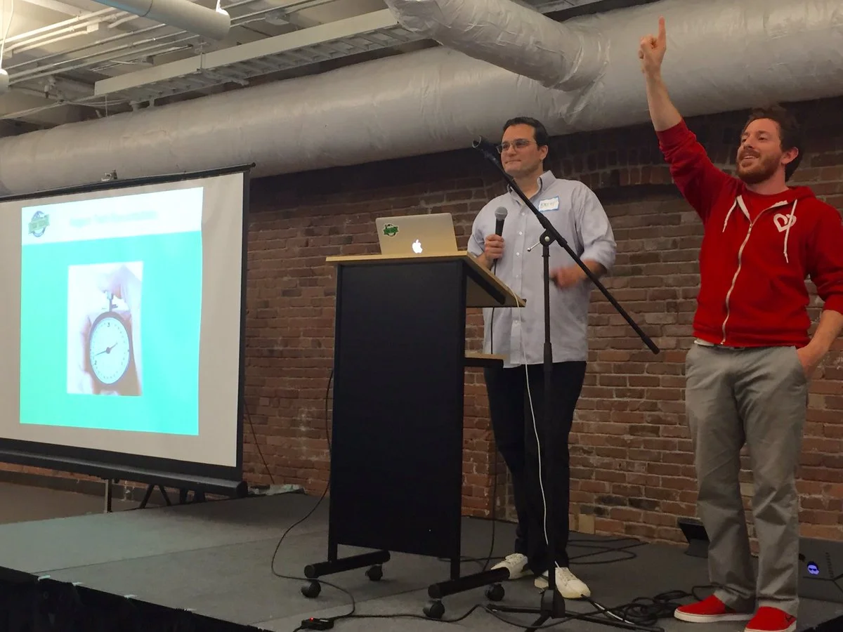 Brett and Red giving a presentation.