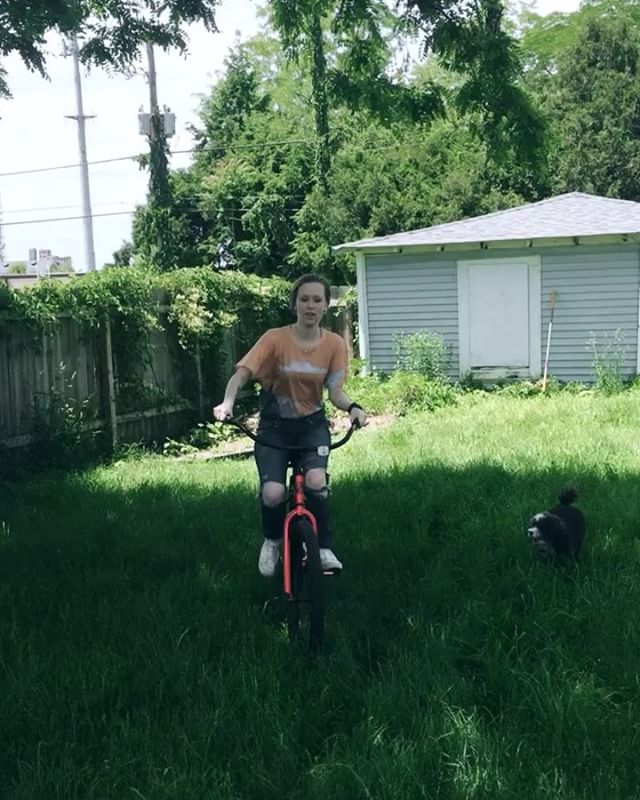 @anelsonwrites repping the essence of stone ⛰ tee during a casual backyard bike ride 🚲🐶☀️
