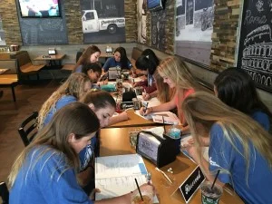 Girl Scouts working on I Care to learn the dangers of distracted driving.
