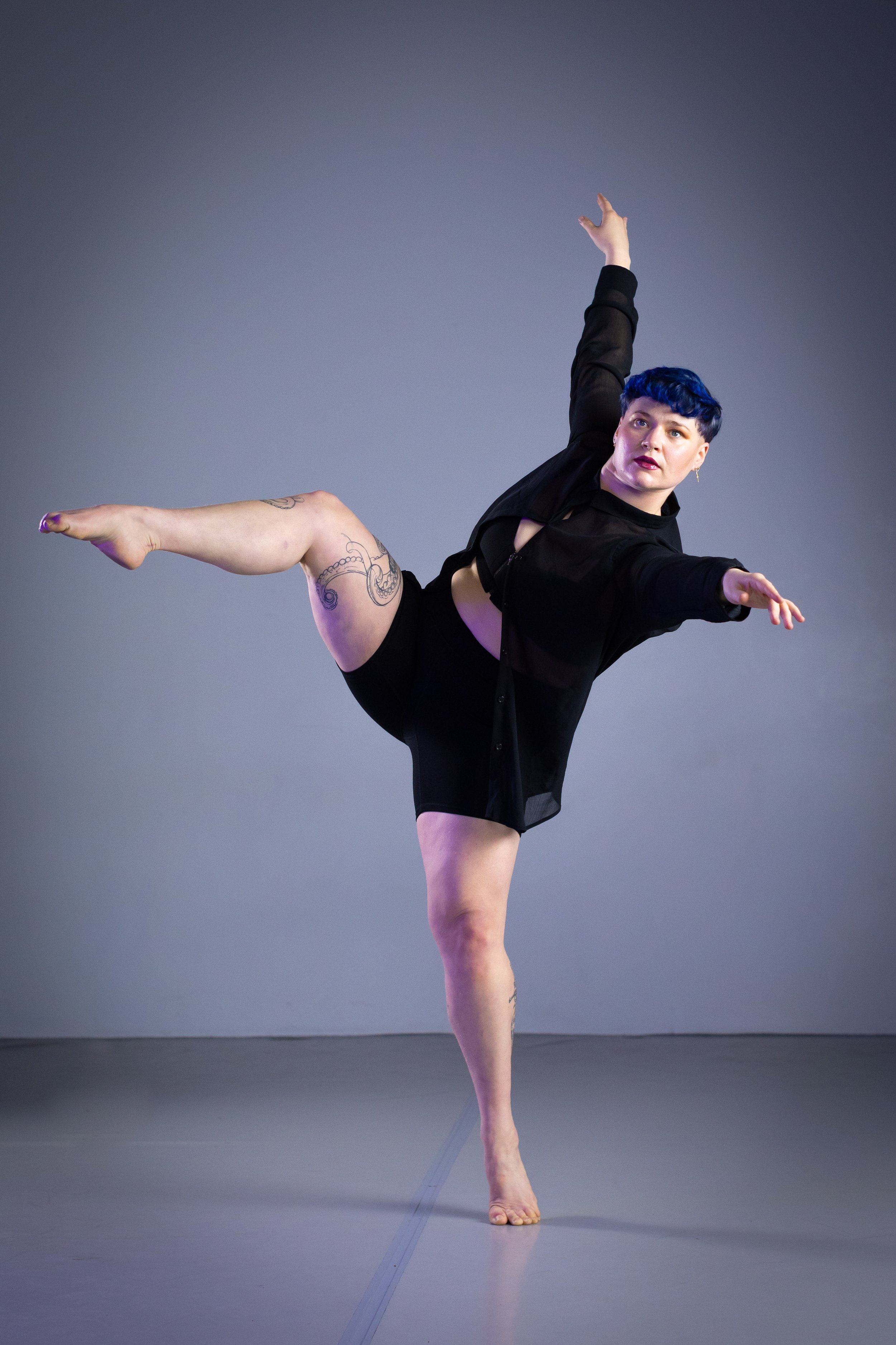 photo of Alex on one foot with leg lifted.  Photographer Warren Woo