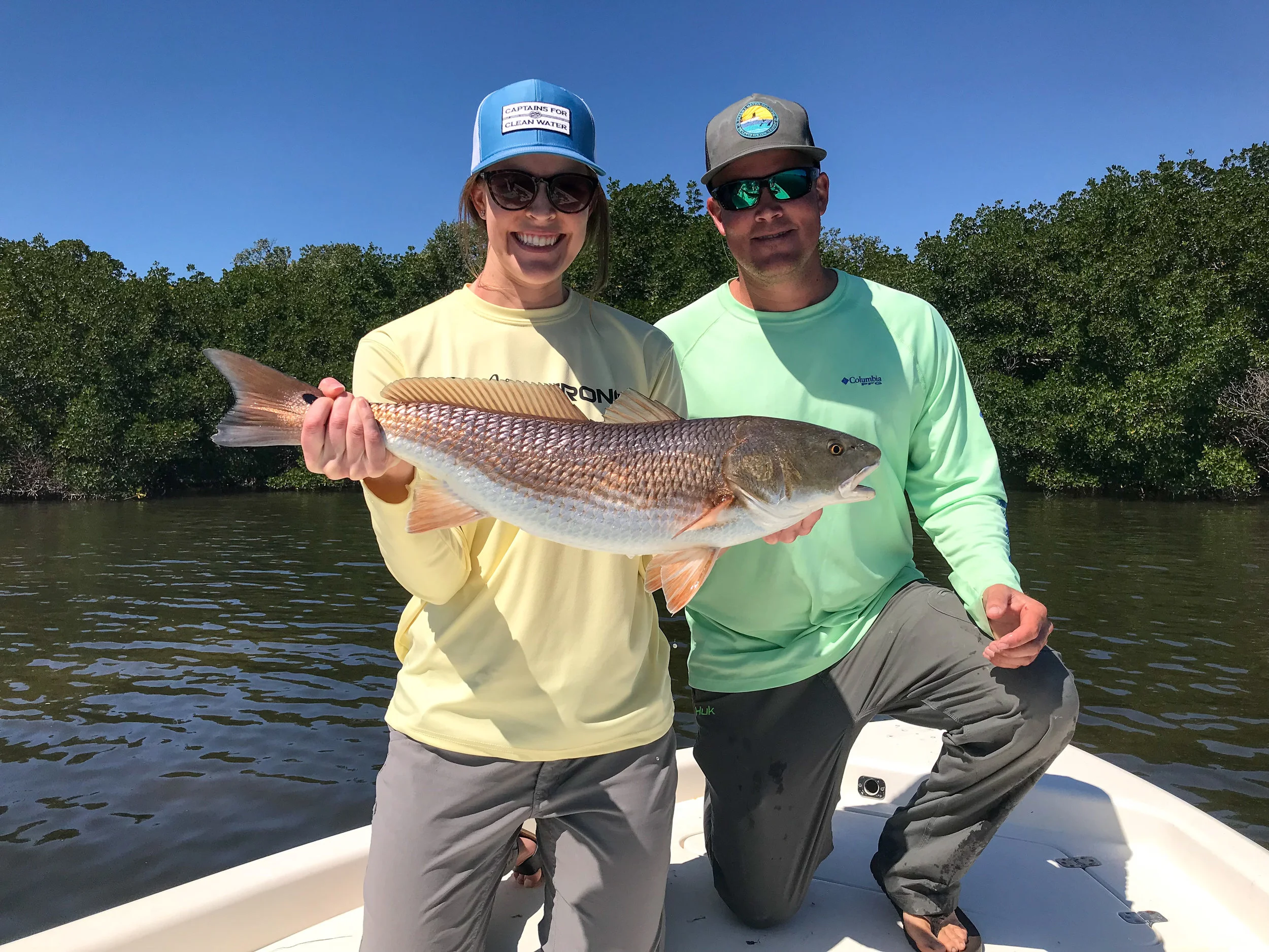CAPT. MIKE DOWNS OF TASK FORCE FISHING CHARTERS AND ANGLER KAITLIN MULHERE