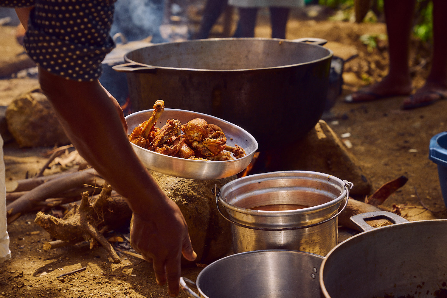 Preparing lunch outside Bethel School, Haiti, 2016.