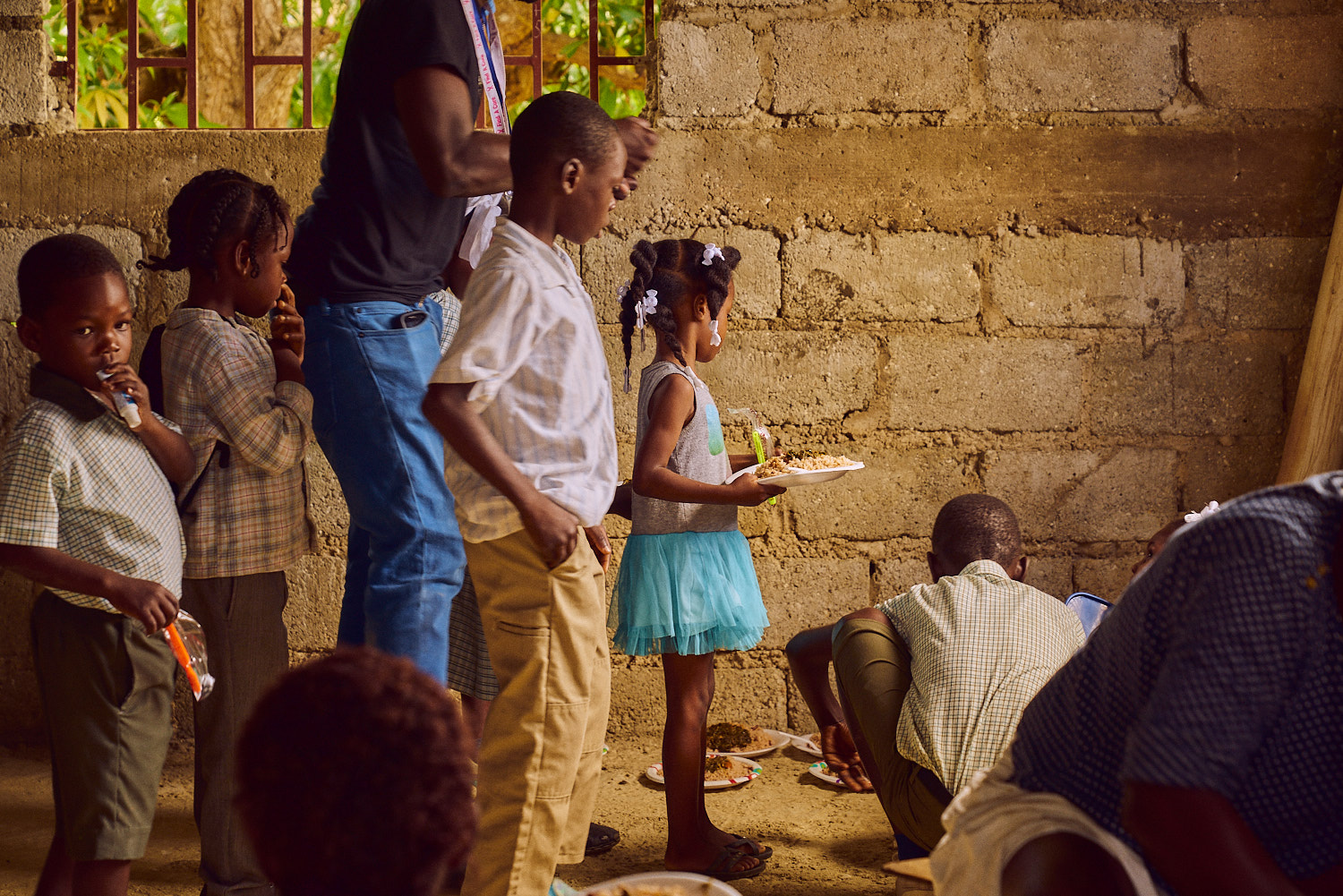 Younger students receive their lunch first.