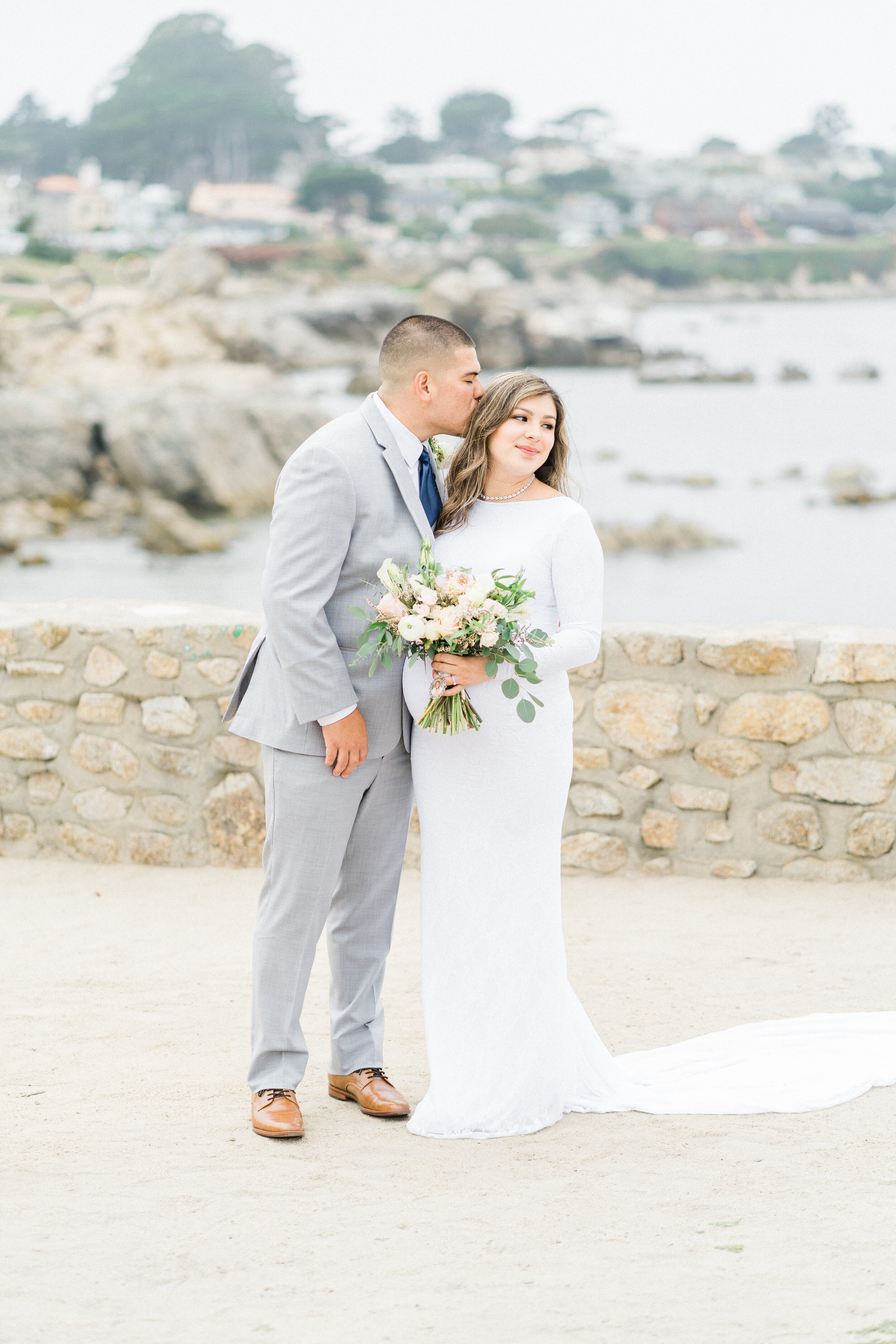 bride and groom at lovers point beach in pacific grove ca