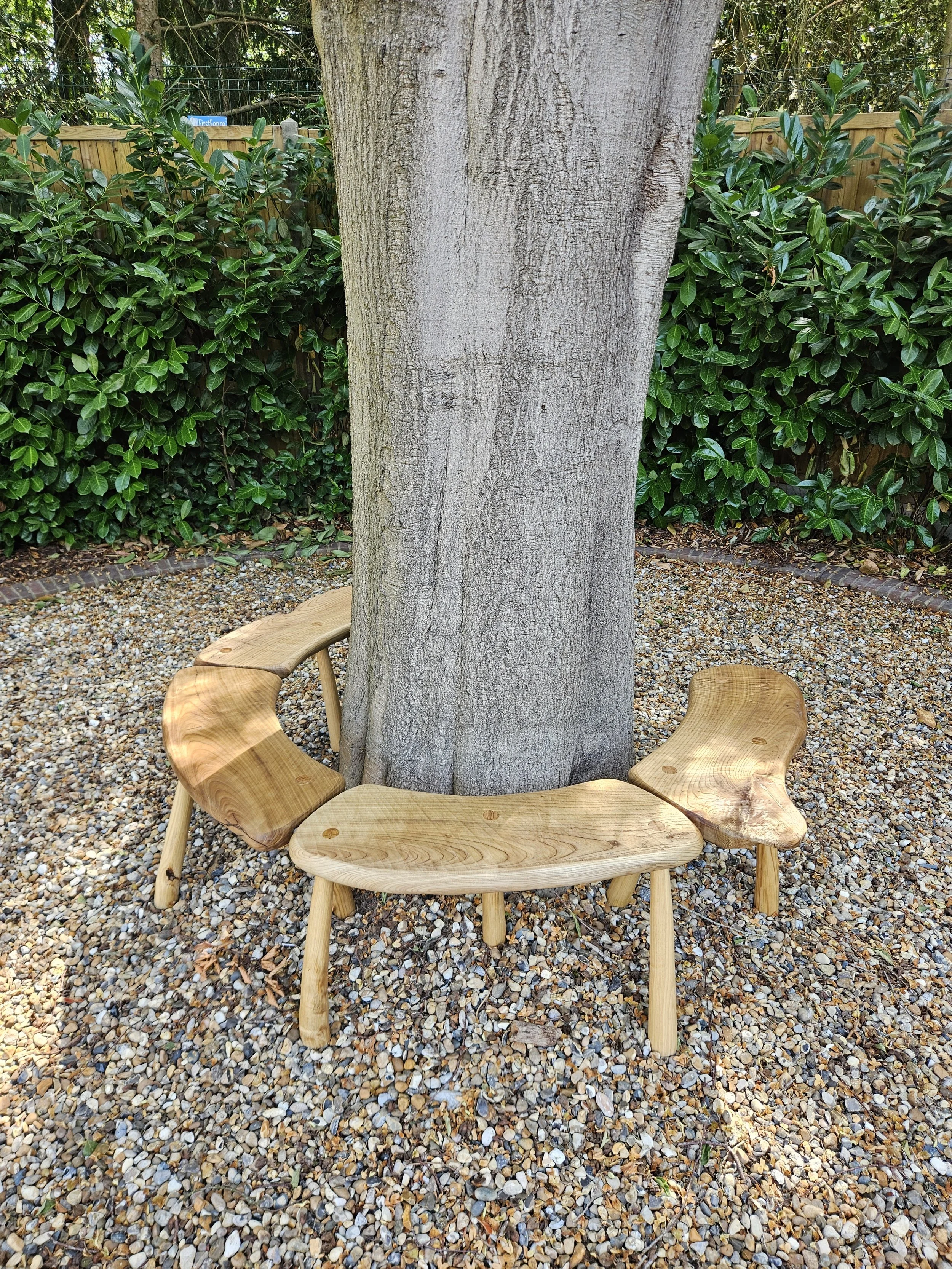 Bespoke handmade wooden tree bench arranged around a mature tree