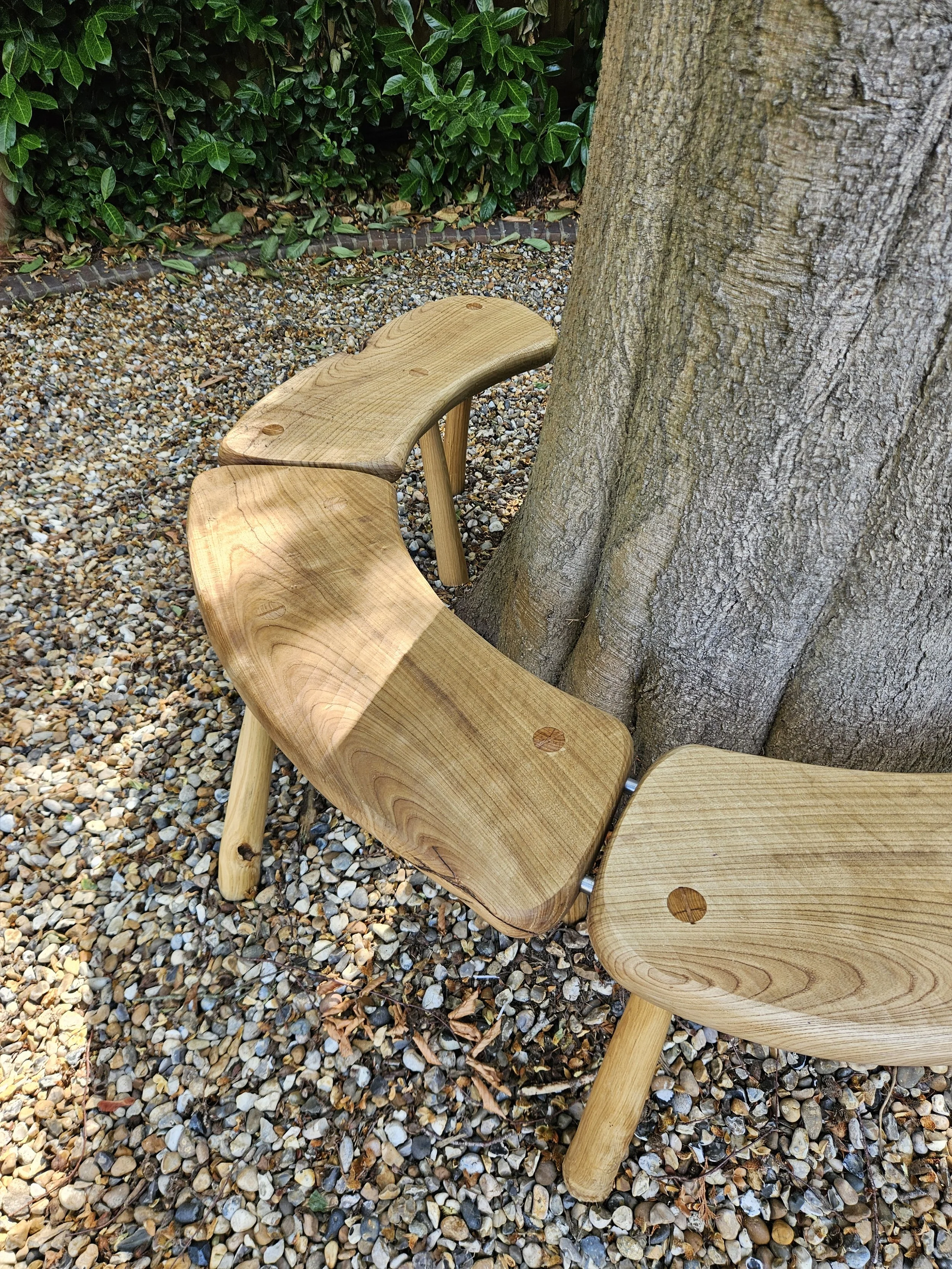 Hand-bulit wooden bench showing stainless dowel connectors.