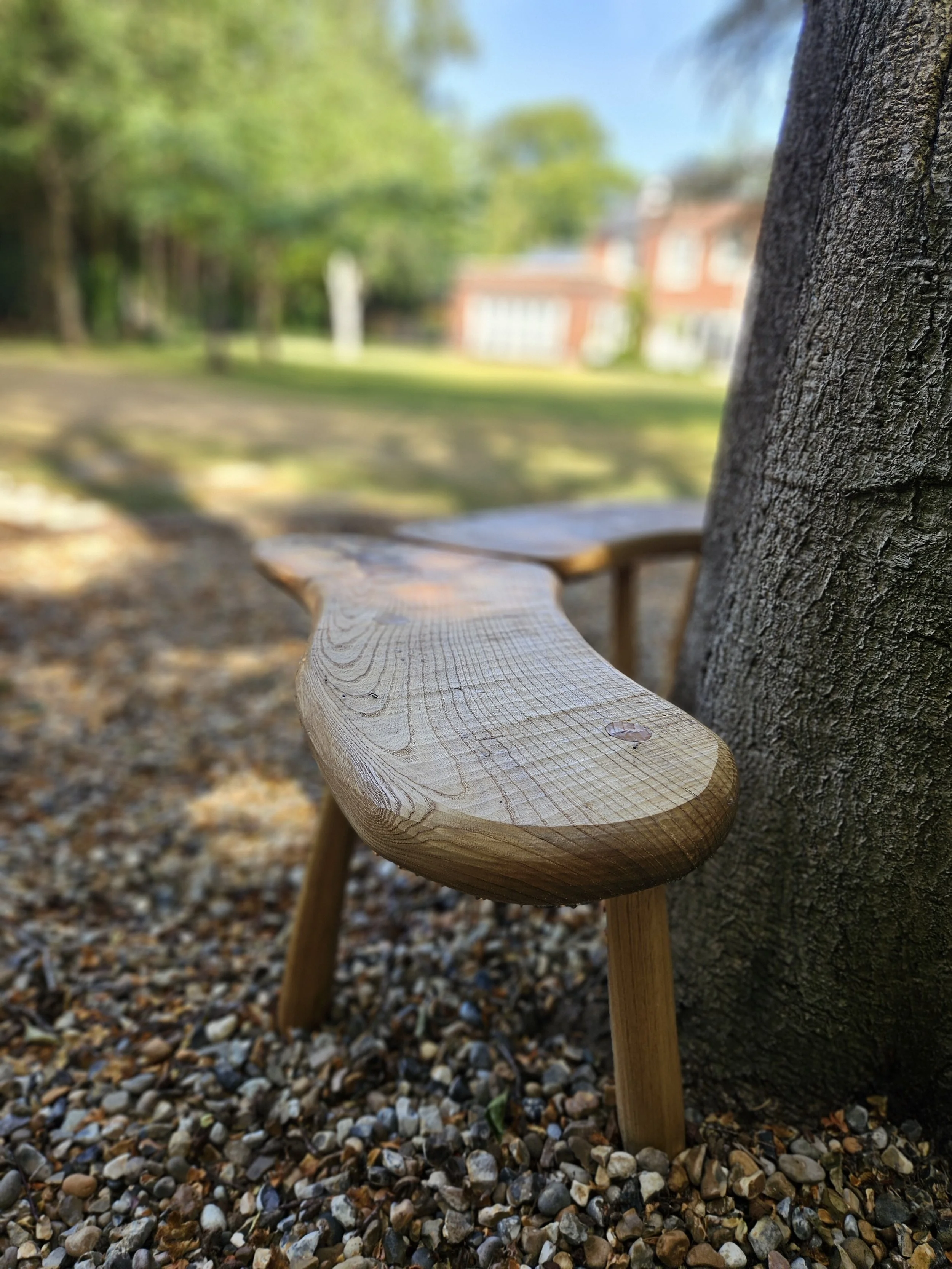 Sculptural seat, made by hand, showing softened, hand-worked edge details.