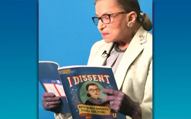 RBG reads I Dissent . Image courtesy of the PJ Library and the Jewish Standard. https://jewishstandard.timesofisrael.com/notorious-rbg-concurs-with-dissent/