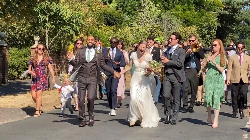 One of the newly wed couples and their band of guests dancing down The Drive from Busbridge Church to their wedding reception last Saturday.  Congratulations Georgie and Tim!