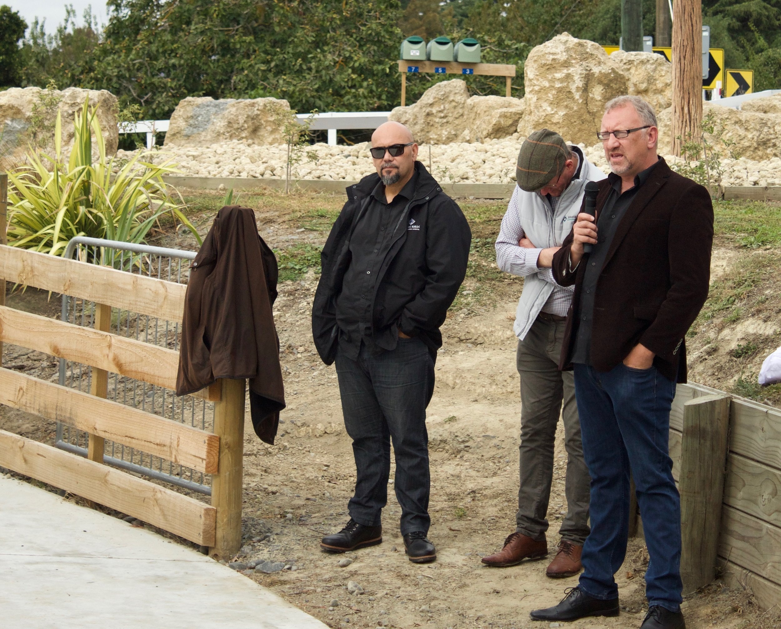 Pāora Sheeran (far right) speaks to the success of Te Piringa Papa Kāinga