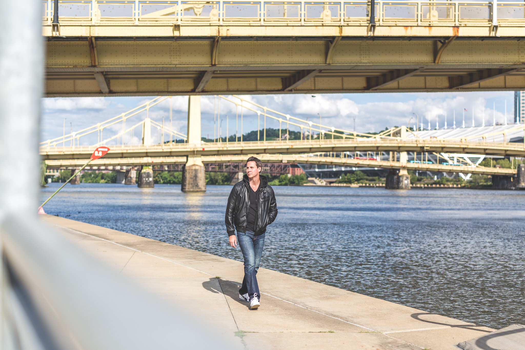 Corporate Magician Tim Kutch walking by the river in Pittsburgh