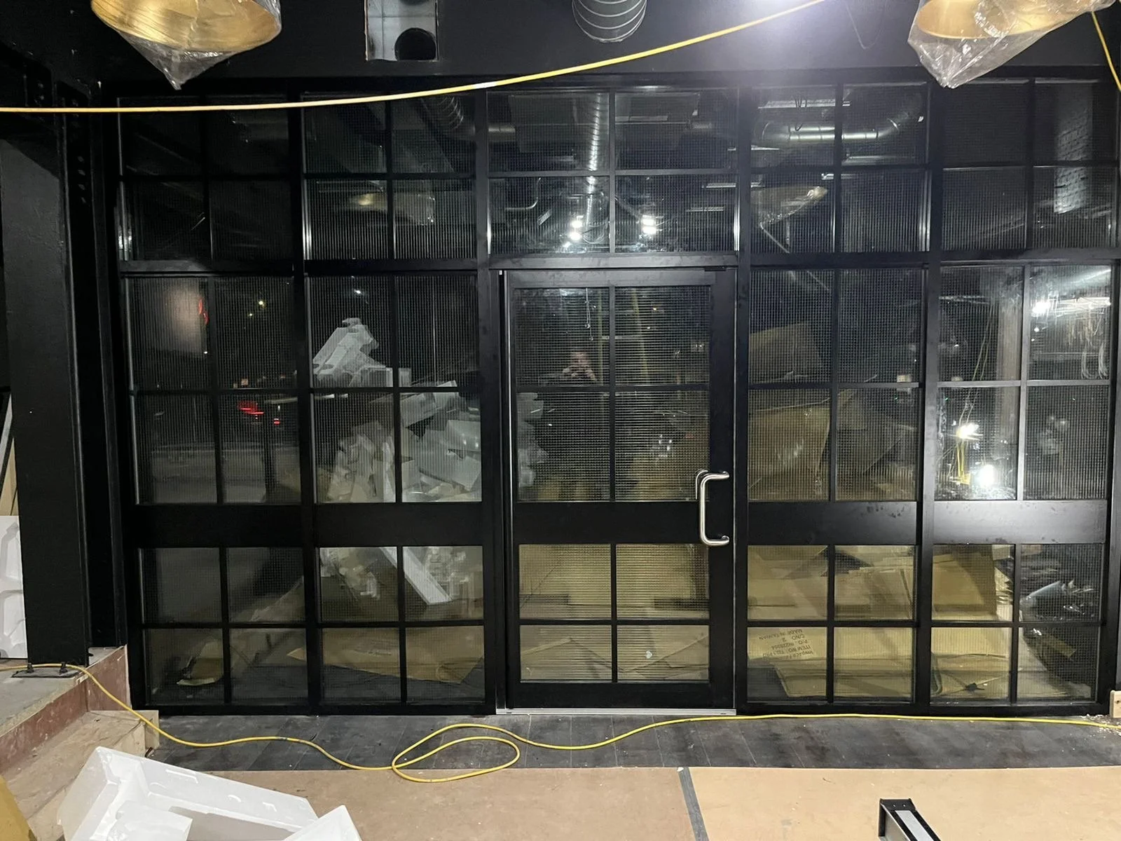 New shopfront with black Georgian detailed panelling