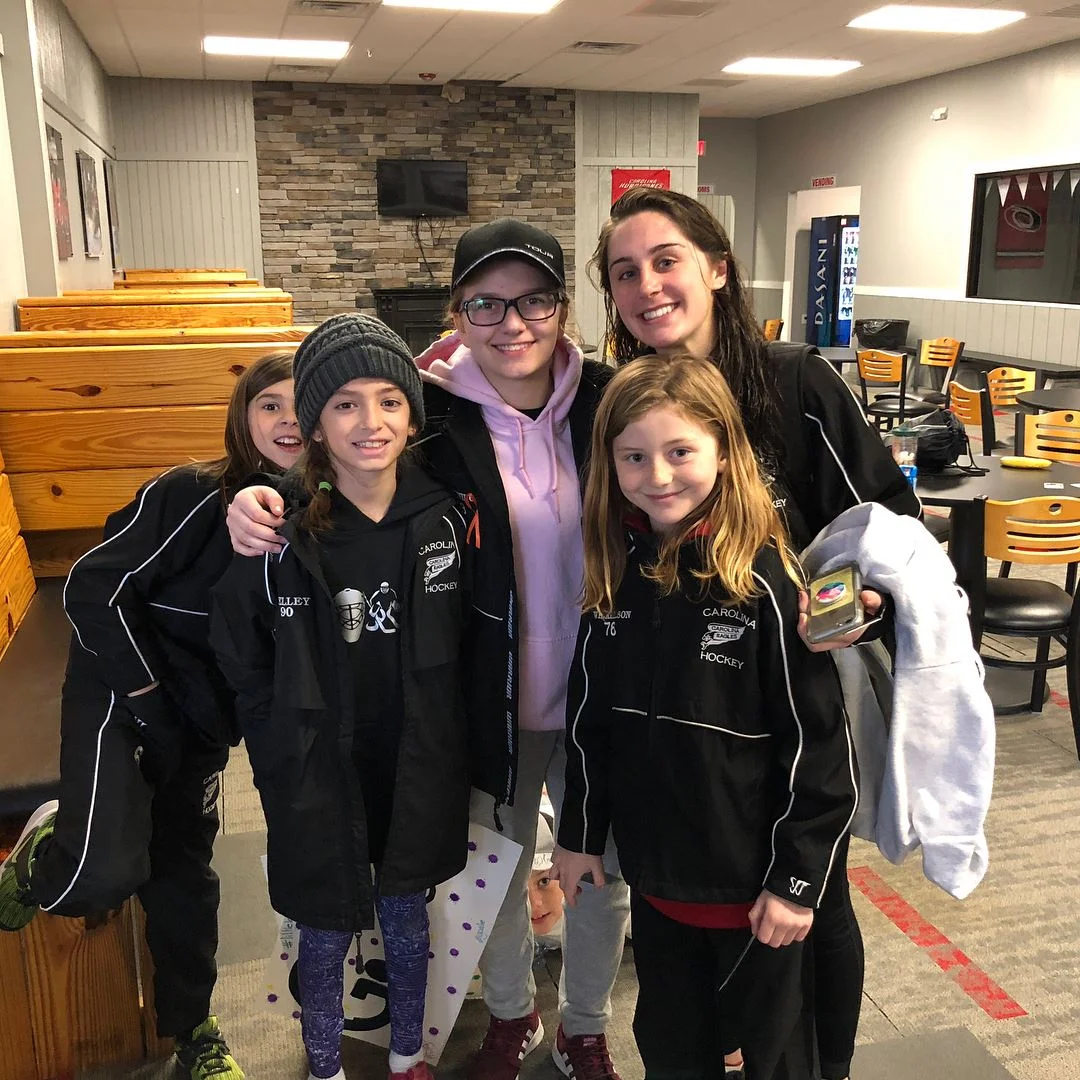 We also match every coed female hockey player with an older full time player to mentor them during their season. Here is a great video of one event.