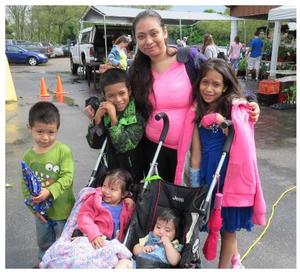 Rosalba "Rosa" Roman and children shopping at the KFM