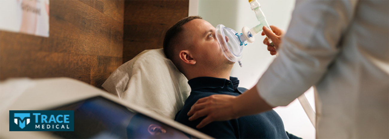 A man in a bed receiving home ventilation services