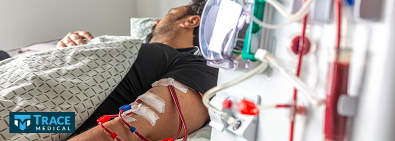 A man in bed receiving dialysis