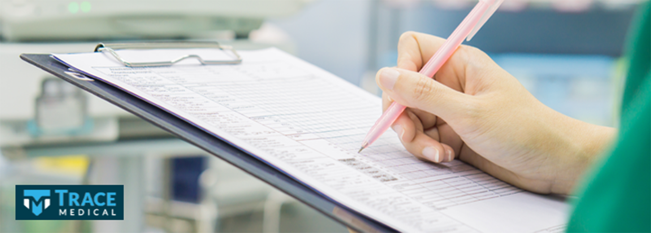 Image of a medical professional filling out a chart