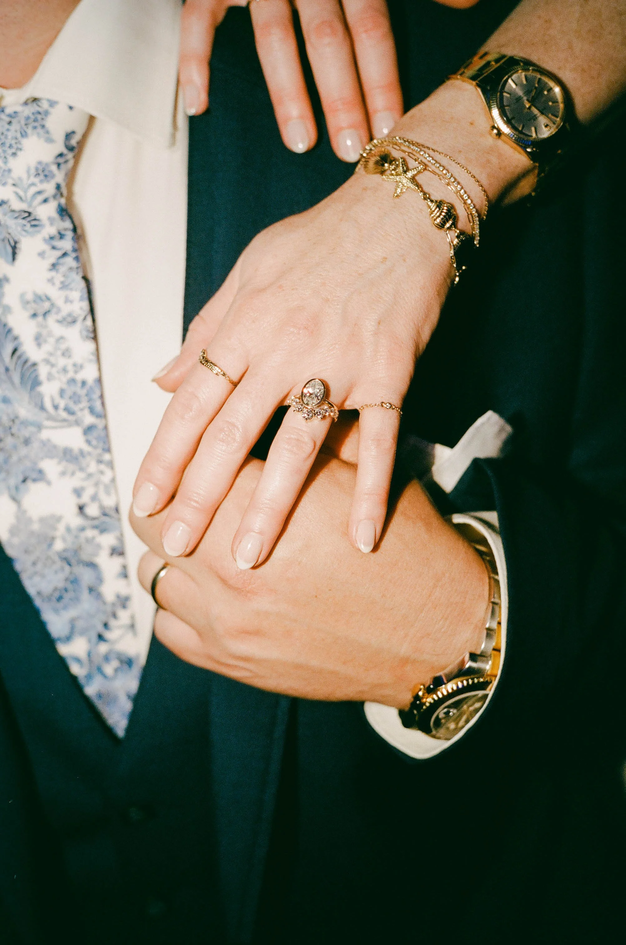 An intimate snapshot of the newly weds in their custom made Lady Cromer Jewelry wedding bands and engagement ring.